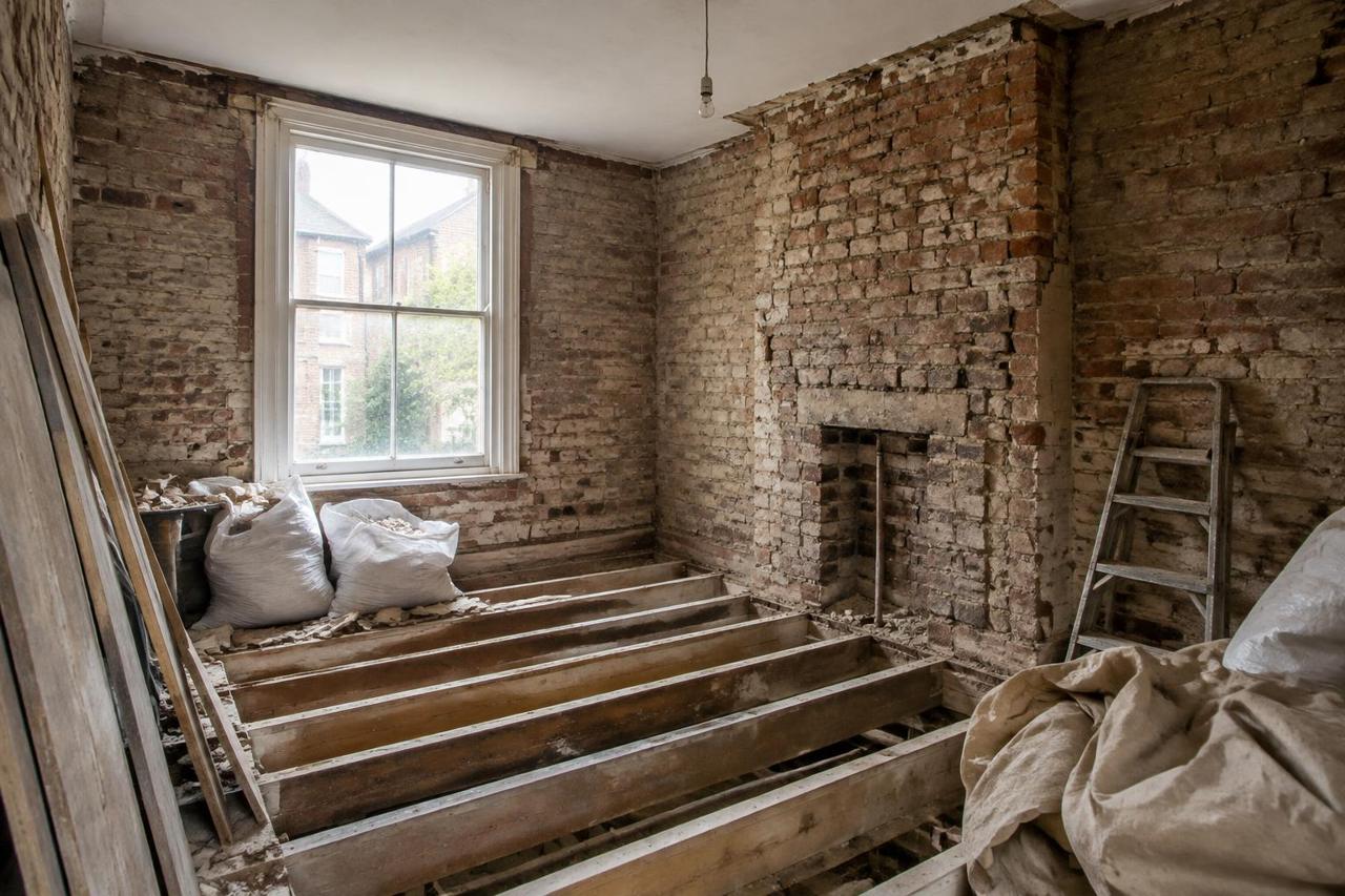 Illustrative image of a UK terraced house interior during strip-out